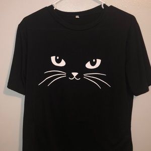 Black shit w a cat on the front
